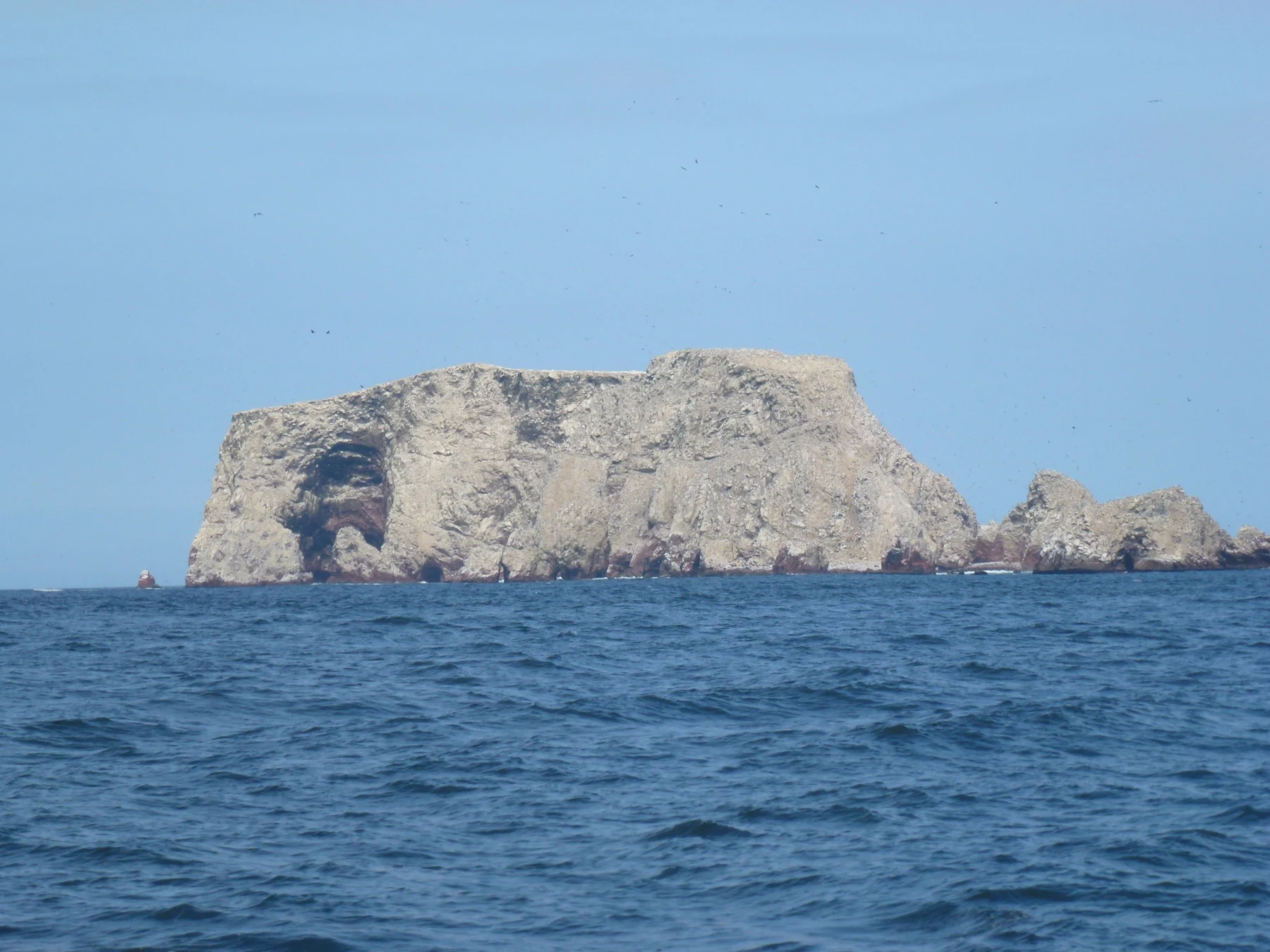 Rocky Ballestas Islands and sea seen from an offshore boat
